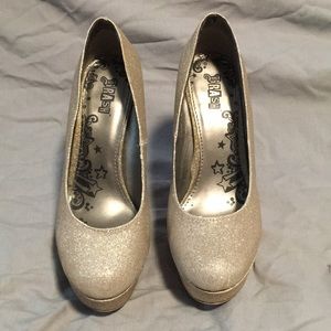 Brash Sparkly gold heels.